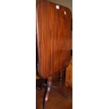 A 19th century mahogany round cornered tilt-top pedestal tripod occasional table