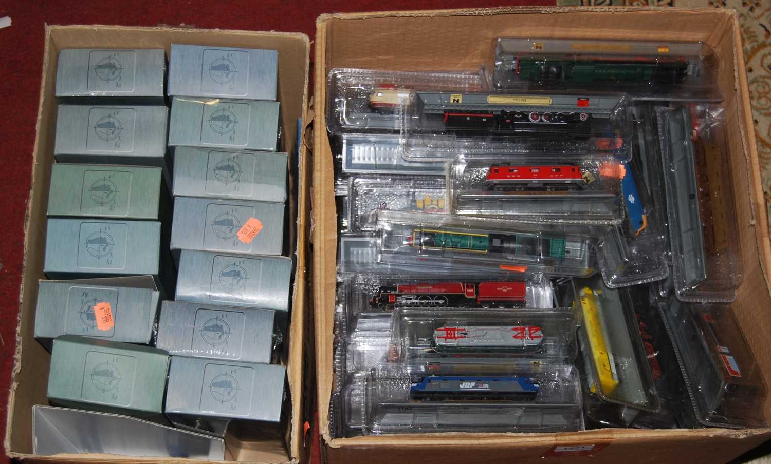 A collection of boxed N gauge display models, replica warships etc