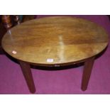 A mahogany oval low occasional table