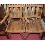 A rustic contemporary Eastern hardwood panelled seat slatback elbow chair; together with a