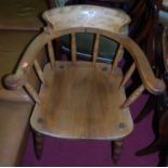 An early 20th century elm and beech captain's chair