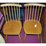 A set of four 1970s beech and plywood seat stickback kitchen chairs