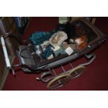 A Silver Cross type dolls pram, of good size; together with sundry modern porcelain head dolls