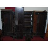 A circa 1900 ebonised and relief carved oak breakfront open bookshelf (comprised of several parts