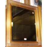A reproduction gilt framed and bevelled rectangular wall mirror, 61 x 52cm