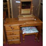 A modern pine single pedestal round cornered dressing table, with associated pine swing dressing