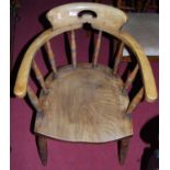 A pair of early 20th century elm and beech captains chairs, on ring turned supports