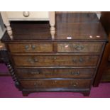 A 19th century oak and mahogany crossbanded squarefront chest, of two short over three long drawers,