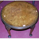 A 1930s figured walnut low circular occasional table, dia. 60cm