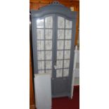 A provincial early 20th century French and later grey painted double door glazed side cabinet,