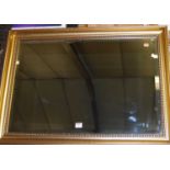 A gilt framed and bevelled rectangular wall mirror, 61 x 86cm