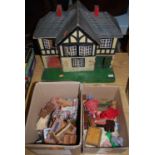 A mid-20th century painted wooden dolls house, having hinged front; together with a quantity of