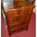 A 19th century German mahogany and flame mahogany commode chest, of four long drawers, having shaped
