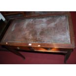 An early 20th century French mahogany and rexine inset two drawer writing table, on slender cabriole
