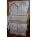 A contemporary pine grey pained kitchen dresser, the two-tier open plate-rack over four short