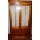 A modern pine double door glazed wardrobe, w.101cm