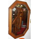 A 1920s beaded oak octagonal bevelled wall mirror, 89.5 x 64cm