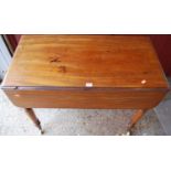 A Victorian mahogany round cornered Pembroke table, having single end drawer and raised on turned