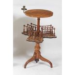A Victorian figured walnut pedestal tripod table, having four-quarter veneered fixed top with