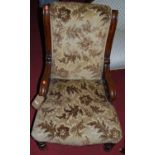 A Victorian mahogany and later floral upholstered nursing chair
