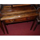 An early 19th century mahogany fold-over tea table, having single long drawer, w.85cm