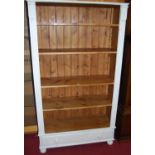 A contemporary white-washed pine freestanding open bookshelf, with single long lower drawer, w.