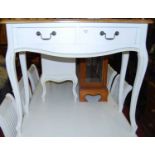 A contemporary French style beech and part white painted serpentine front two-drawer side table on