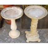 A reconstituted stone dish-top pedestal bird-bath, the fluted column decorated with floral