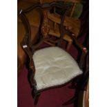 A circa 1900 mahogany floral satinwood bone inlaid and further strung shield back open elbow chair