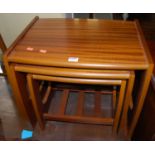 A 1970s teak nest of three occasional tables, the largest width 50cm