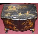 An early 20th century chinoiserie black lacquered low serpentine front hinge-top coal box, with