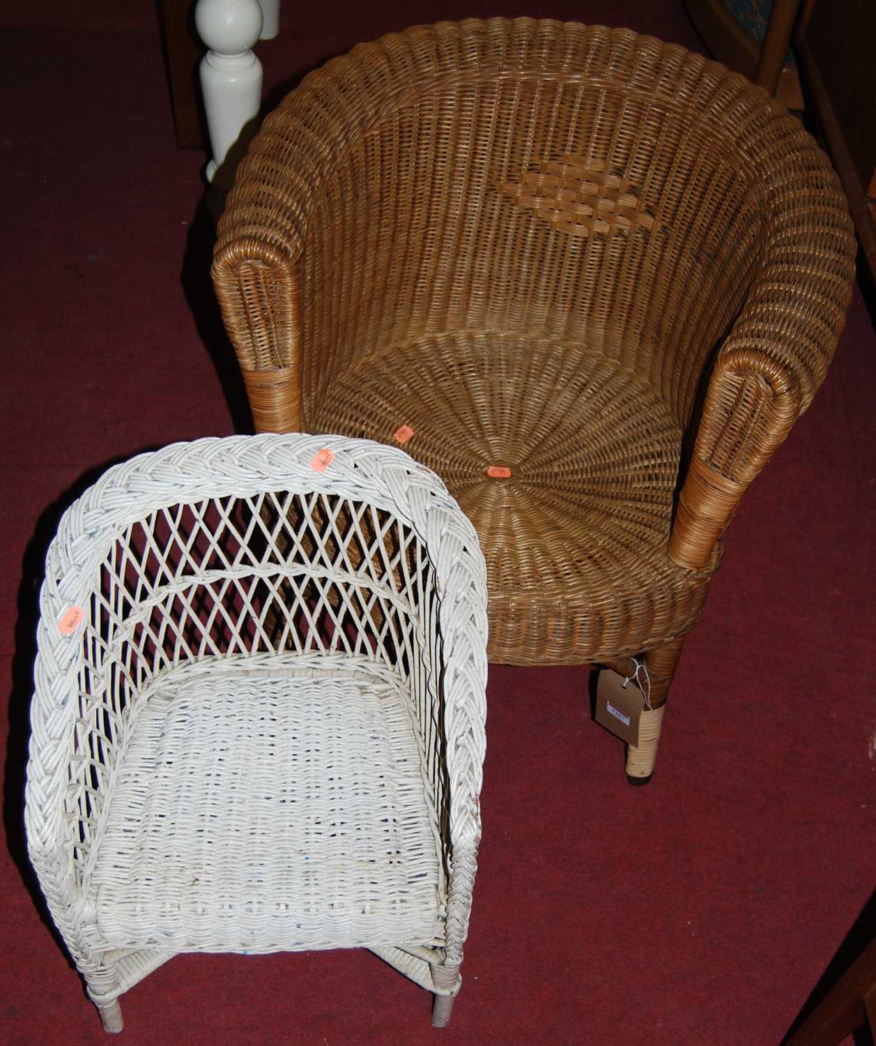 An early 20th century wicker childs tub chair, and one other painted smaller similar example (2)