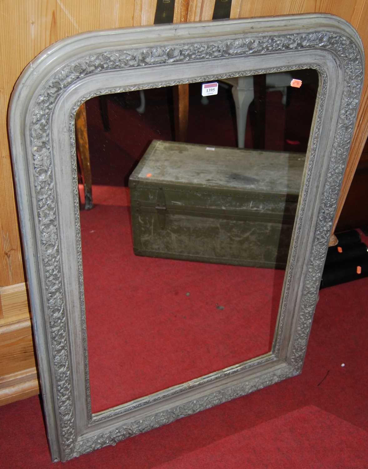 A 19th century French pine and floral gesso framed grey painted arched wall mirror 105 x 74cm