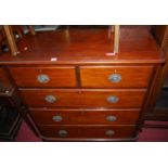 A mid-Victorian mahogany round cornered chest of two short over three long graduated drawers,
