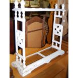 A Victorian cast iron and later white painted six division stick stand, width 66cm