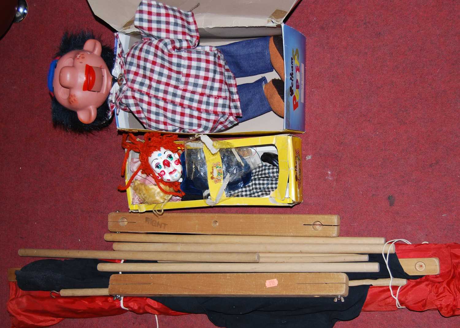 A boxed Pelham ventriloquist puppet; together with one other Pelham puppet, and a travelling