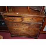 An early 19th century mahogany square front chest of two short over three long graduated drawers,