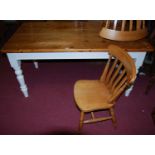A modern pine and part painted round cornered farmhouse kitchen table, having single end drawer,