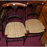 A pair of 19th century rosewood bar back cane seat bedroom chairs on spindle turned supports