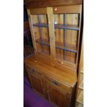 A modern pine dresser having double door lead glazed upper section, width 92.5cm