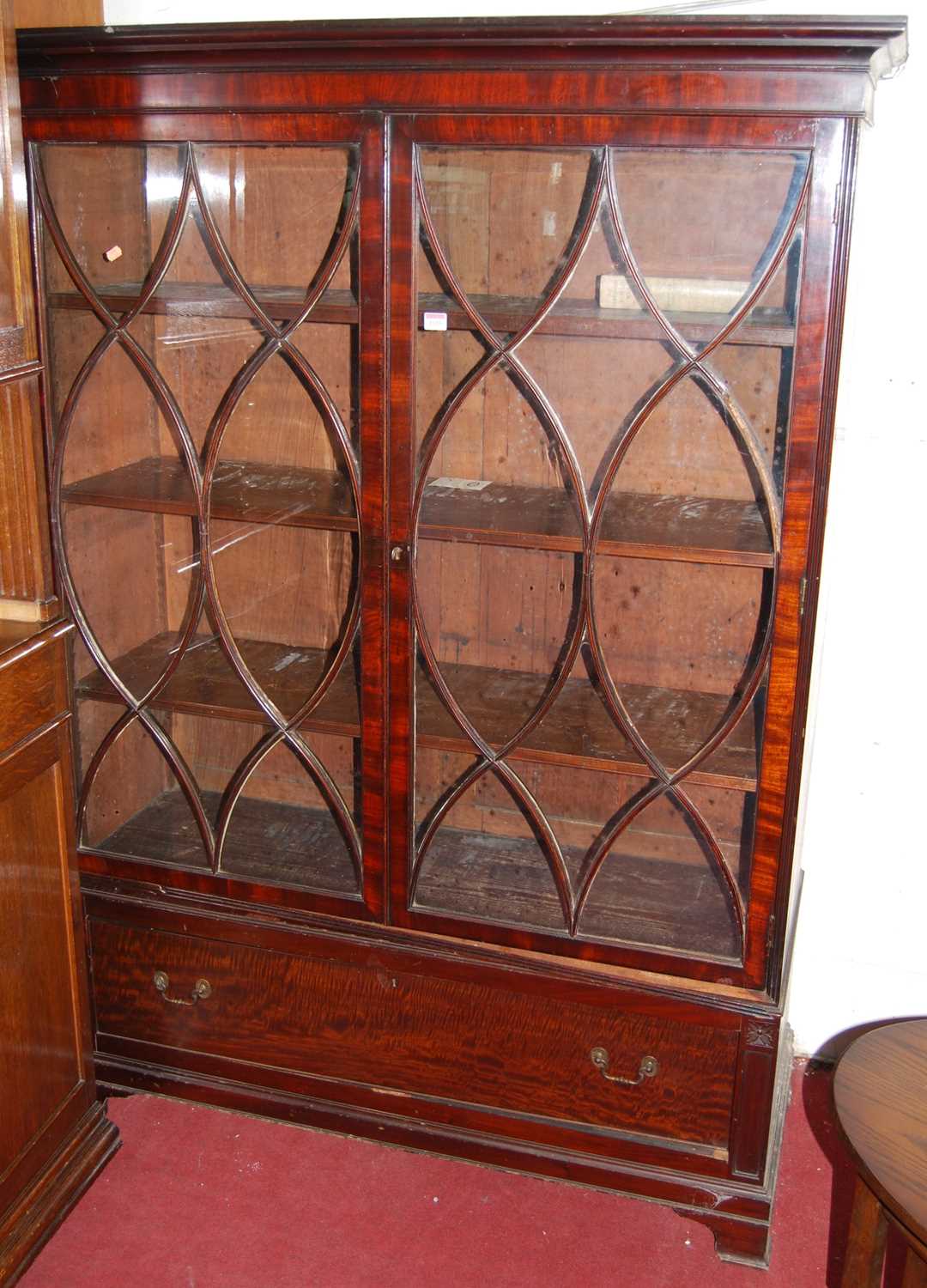 A 19th century mahogany double door glazed bookcase, having single long lower drawer, w.130cm