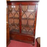 A 19th century mahogany double door glazed bookcase, having single long lower drawer, w.130cm