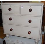 A Victorian pine and later grey painted low chest, of two short over two long drawers, on turned