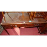 A circa 1900 mahogany and tan rexine inset two drawer writing table, width 122cm