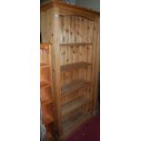 A large modern pine freestanding open bookshelf, with fluted detail, w.91cm