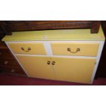 A 1950s yellow painted double door kitchen cupboard, having twin frieze drawers and formica top,