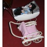 A vintage child's dolls pram; one other; and a modern porcelain head doll (3)