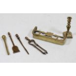 A miniature brass fire fender; together with miniature fire tongs, poker, shovel, and candlestick