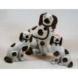 A late Victorian Staffordshire pottery model of a seated spaniel, height 25cm, together with a