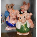 A set of five Wade Natwest money-box pigsCondition report: Baby pig missing stopper. All grubby